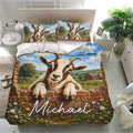 Goat bedding set presented on a modern bed with a detailed countryside scene, barn, hills, flowers, and blue sky