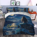 Mermaid duvet cover styled in a bedroom with a moonlit sea scene and shimmering tail artwork
