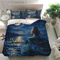 Mermaid bedding set displayed in a bright bedroom with matching pillowcases and deep ocean artwork