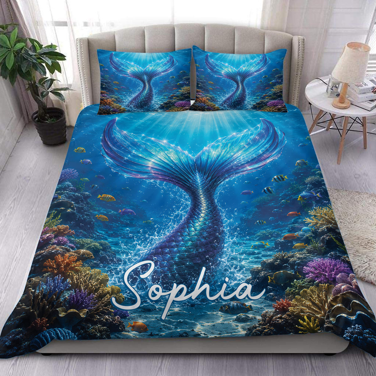 Mermaid duvet cover set displayed on a bed with a glowing blue underwater scene and colorful coral reef