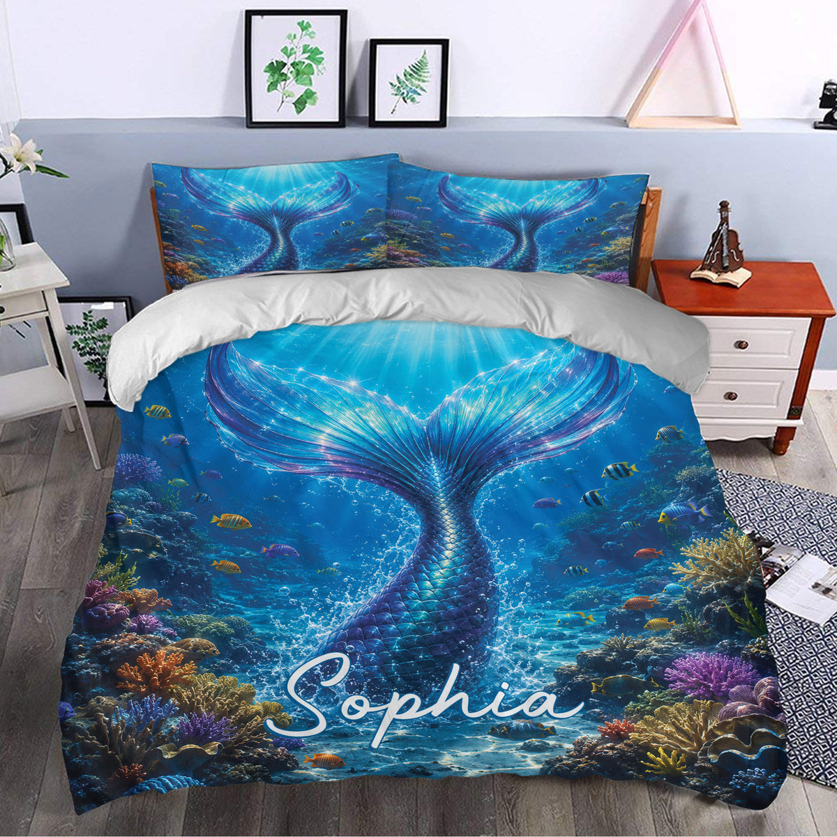 Mermaid duvet cover bedding set styled in a bedroom with a large shimmering tail and coral reef scene