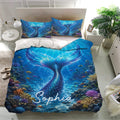 Blue mermaid bedding set displayed in a bright bedroom with underwater artwork and matching pillowcases