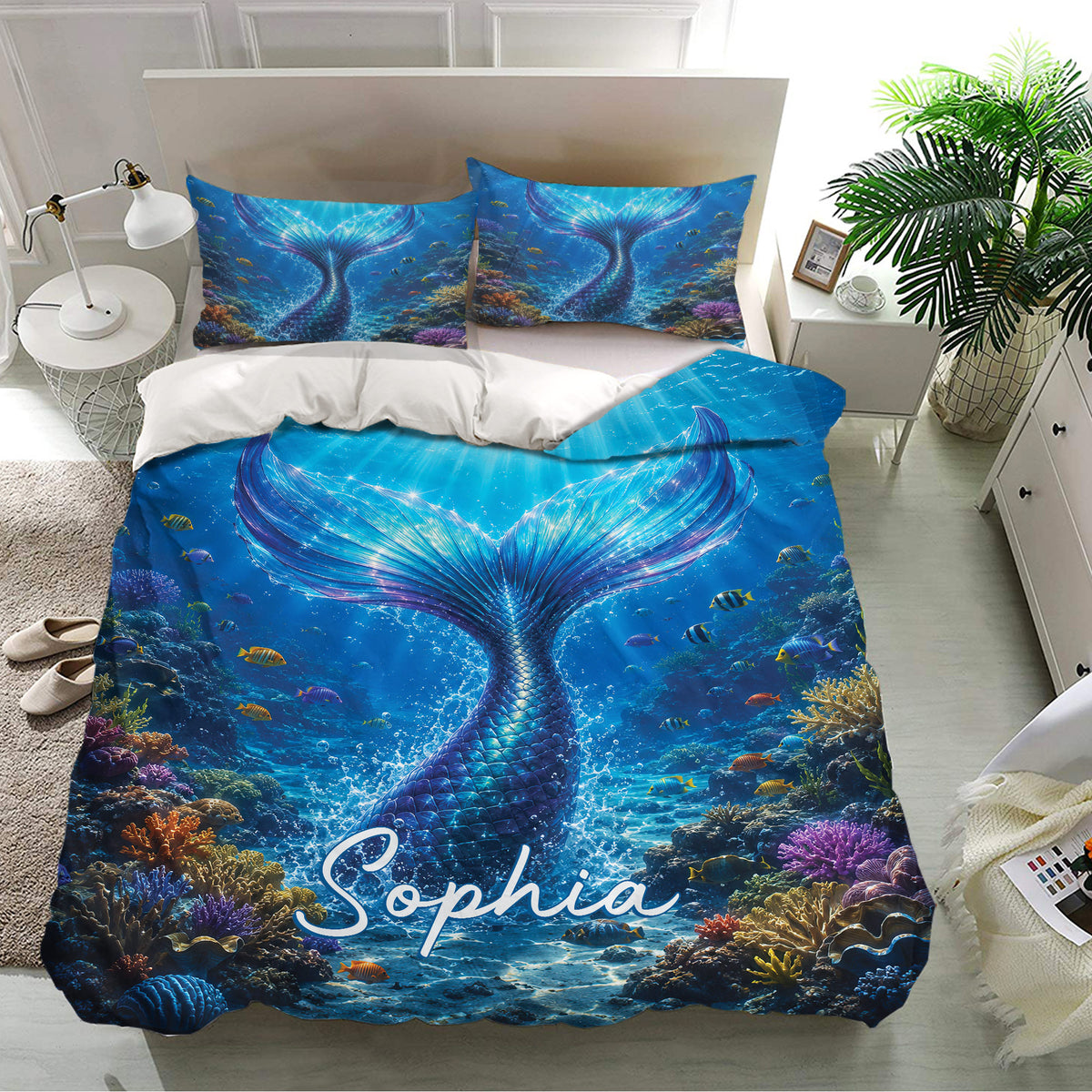 Blue mermaid bedding set displayed in a bright bedroom with underwater artwork and matching pillowcases