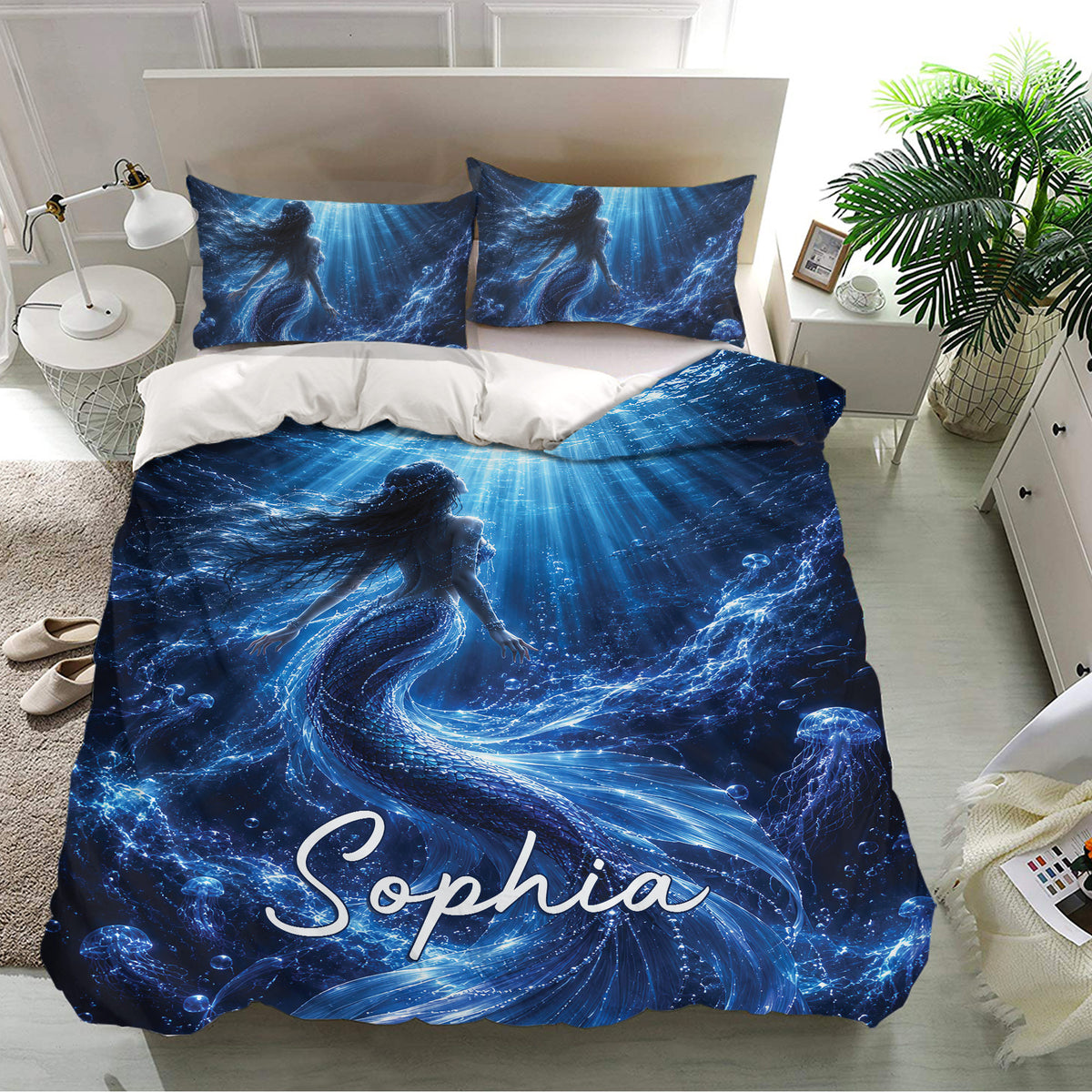 Blue mermaid bedding set displayed in a bright bedroom with underwater artwork and matching pillowcases