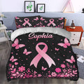 Breast cancer awareness duvet cover styled in a bedroom with pink ribbons, butterflies, and flower borders
