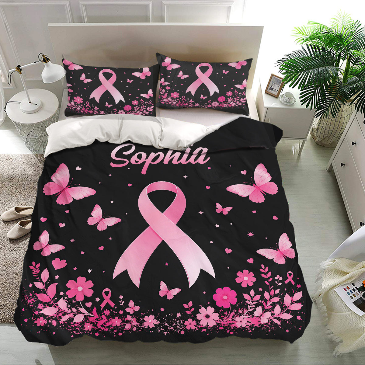 Black and pink breast cancer awareness bedding with ribbon artwork, butterflies, hearts, and floral accents