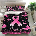 Breast cancer awareness bedding with large pink ribbon artwork, butterflies, and sparkling accents