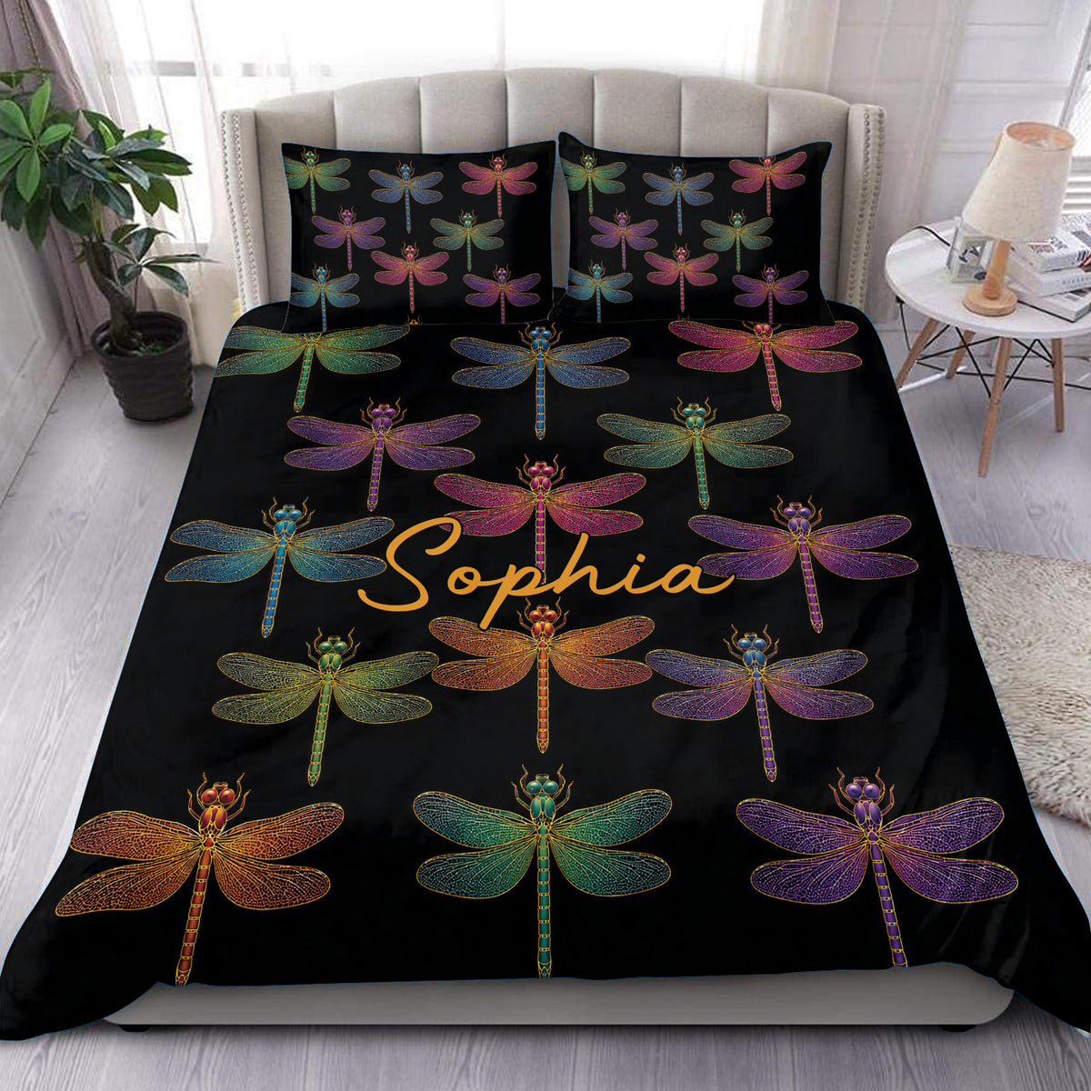 Colorful dragonfly duvet cover set displayed on a modern bed with matching black pillowcases