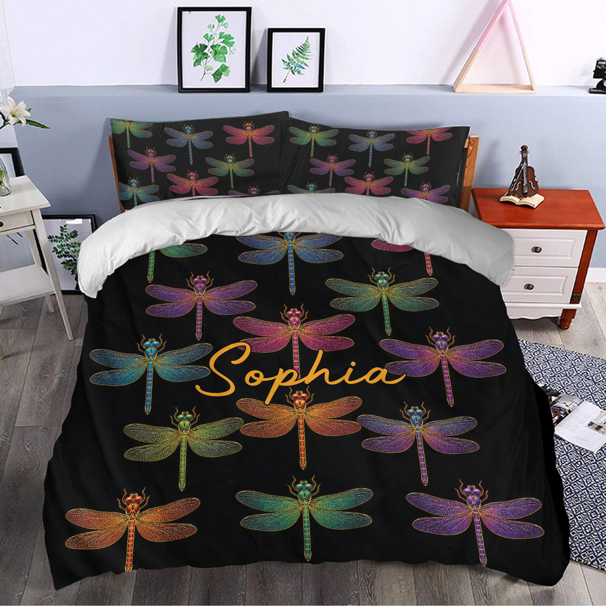 Colorful dragonfly duvet cover styled in a bright bedroom with botanical wall art