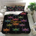 Black dragonfly bedding set with jewel-tone artwork styled in a modern bedroom