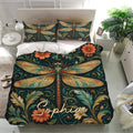 Ornate dragonfly bedding set presented in a bright bedroom with matching pillows and floral vintage-style artwork