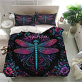 Dragonfly duvet cover set presented on a bright bedroom bed with coordinated floral pillowcases