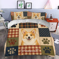 Corgi duvet cover styled in a bedroom with smiling dog artwork, paw prints, and rustic plaid panels