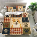 Corgi bedding set displayed in a bright bedroom with matching pillows and multicolor patchwork design