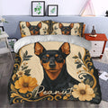 Miniature Pinscher duvet cover set styled in a bedroom with ornate floral artwork and matching pillowcases