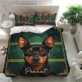 Miniature Pinscher bedding set presented on a modern bed with matching dog portrait pillowcases and elegant green decor