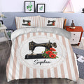 Sewing-themed duvet cover styled in a bedroom with vintage machine artwork and red flowers