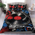 DJ duvet cover set displayed on a bed with turntables, vinyl records, and bold red, black, and blue artwork