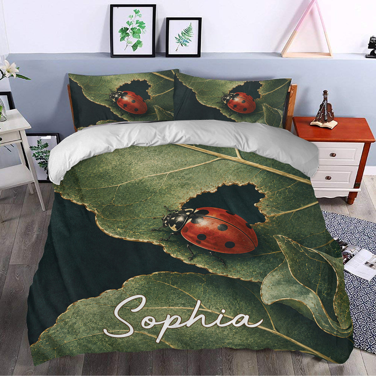 Ladybug duvet cover bedding styled in a bedroom with botanical green leaves and vivid red insect artwork