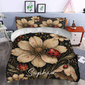 Ladybug duvet cover styled in a bedroom with oversized cream flowers, botanical leaves, and red insect details