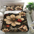 Ladybug bedding set displayed in a bright bedroom with large floral artwork and coordinated pillowcases