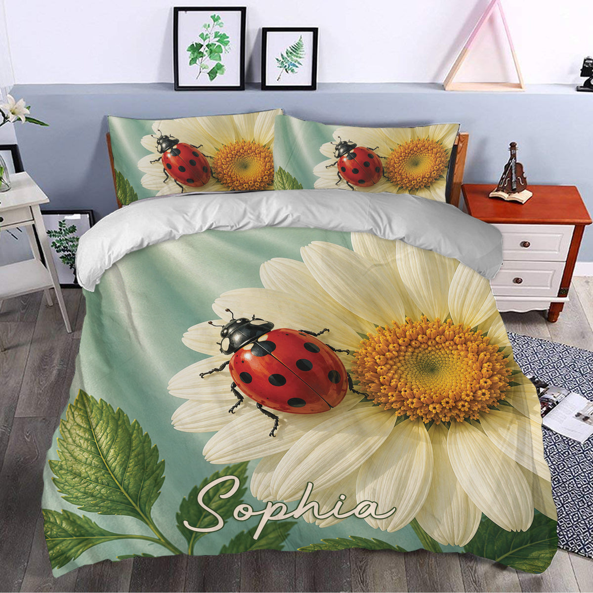 Ladybug duvet cover set styled in a bedroom with large daisies, green foliage, and sage botanical tones