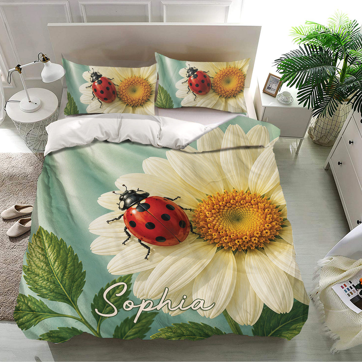 Floral ladybug bedding set presented in a bright bedroom with daisy, leaf, and sage green artwork