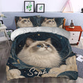 Ragdoll cat duvet cover set styled in a bright bedroom with matching pillows and ornate blue artwork