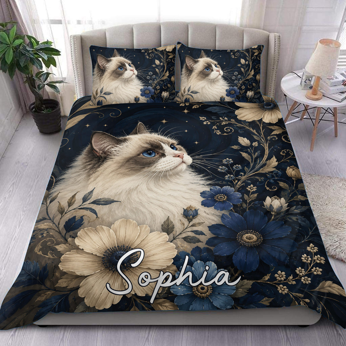 Ragdoll cat duvet cover set with blue flowers, gold botanical details, and a deep navy bedroom design