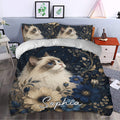 Ragdoll cat bedding styled in a bedroom with blue floral artwork and a large illustrated cat