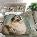 Ragdoll cat bedding set displayed in a bright bedroom with matching pillowcases and detailed teal artwork