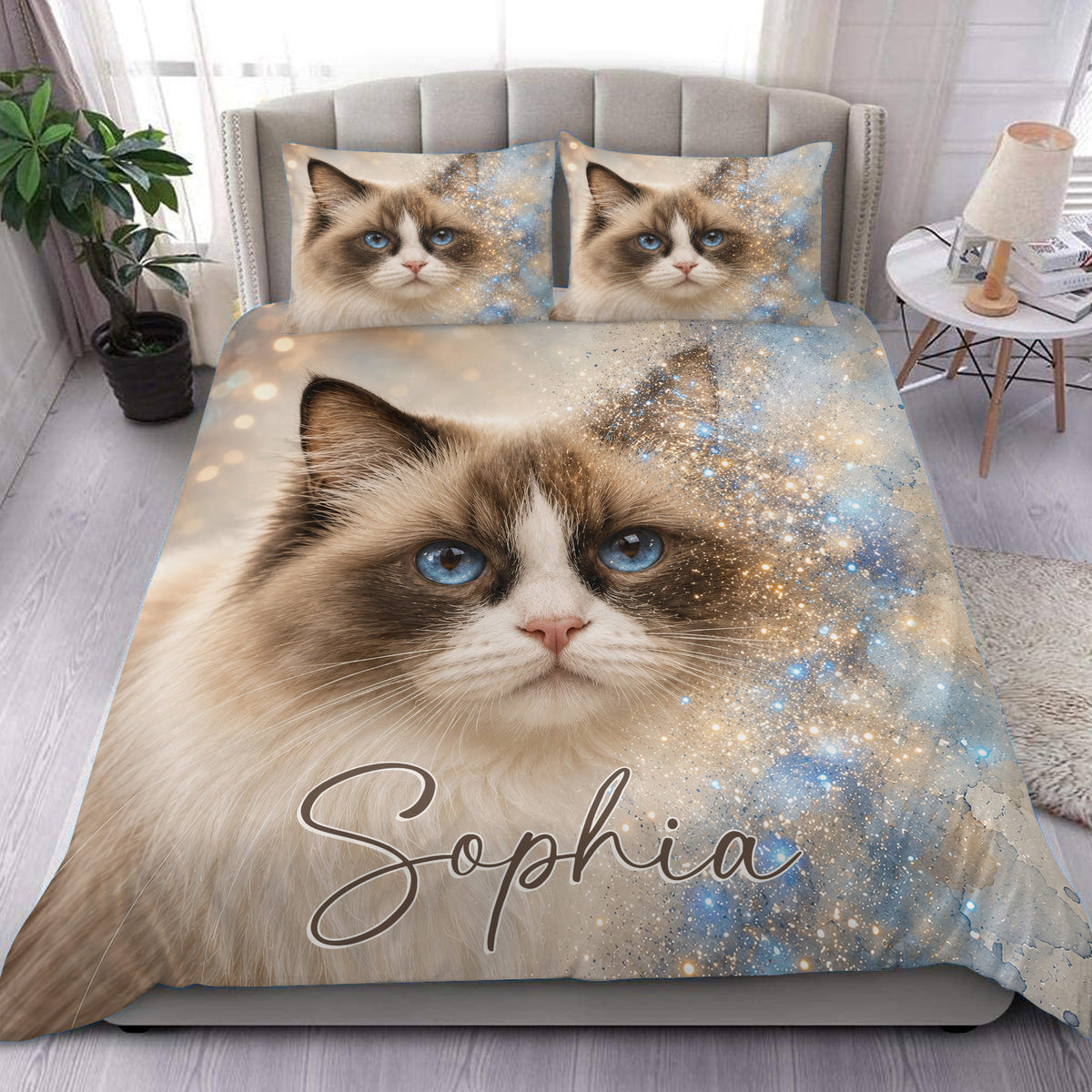 Ragdoll cat duvet cover set displayed on a bed with blue eyes, soft beige fur, and a starry blue design