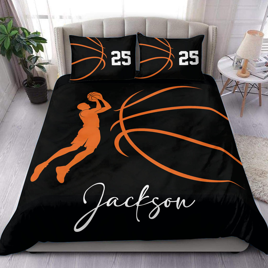 Black and orange basketball duvet cover set styled on a bedroom bed with a shooting player silhouette