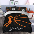 Black basketball duvet cover set with orange court lines and shooting player artwork in a bedroom