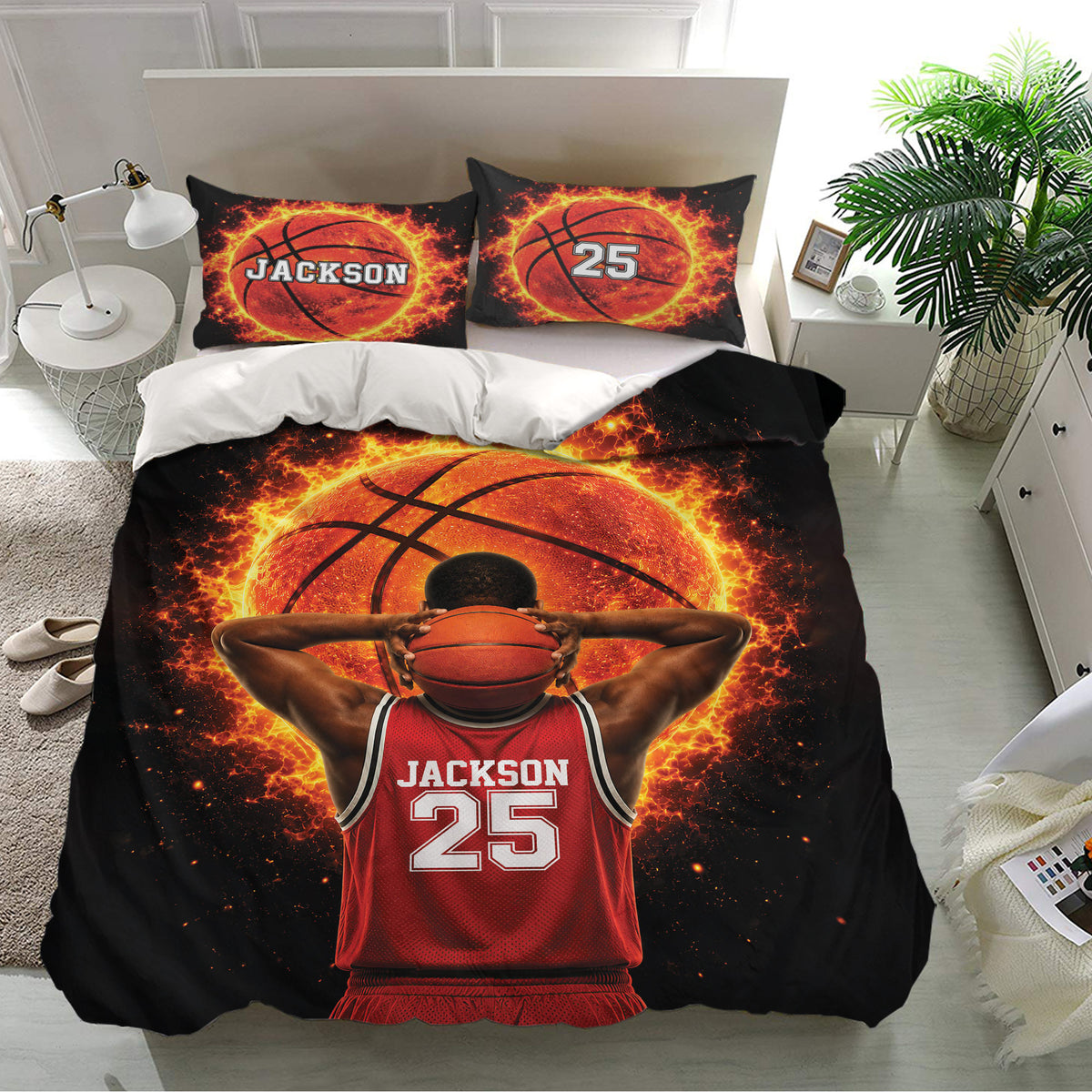Basketball bedroom decor featuring a black duvet cover with glowing orange ball artwork and matching pillows