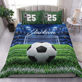 Soccer duvet cover set styled on a bed with a stadium field, goal net, soccer ball, and green turf design
