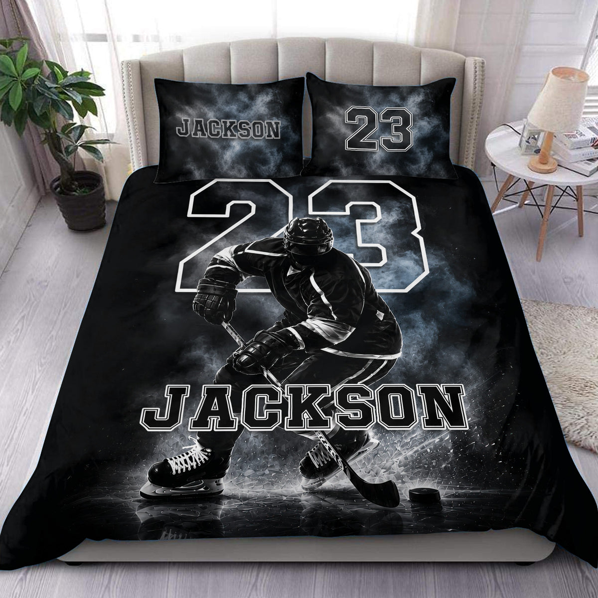 Black hockey duvet cover set displayed on a bed with an ice hockey player, rink scene, bold number, and custom lettering