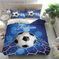 Soccer bedding set displayed in a bright bedroom with blue goal net artwork and matching pillows