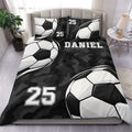 Custom soccer duvet cover bedding set with bold soccer balls, black camouflage artwork, and bedroom styling