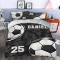 Custom soccer duvet cover styled in a bedroom with oversized soccer balls and black camouflage accents