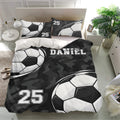Black and white soccer duvet cover bedding set shown on a modern bed with bold sports room decor
