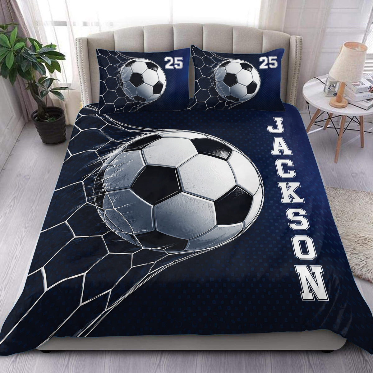 Soccer duvet cover set displayed on a bed with a large soccer ball design in navy blue and white
