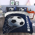 Soccer duvet cover styled in a bedroom with a large soccer ball graphic and dark blue sports design