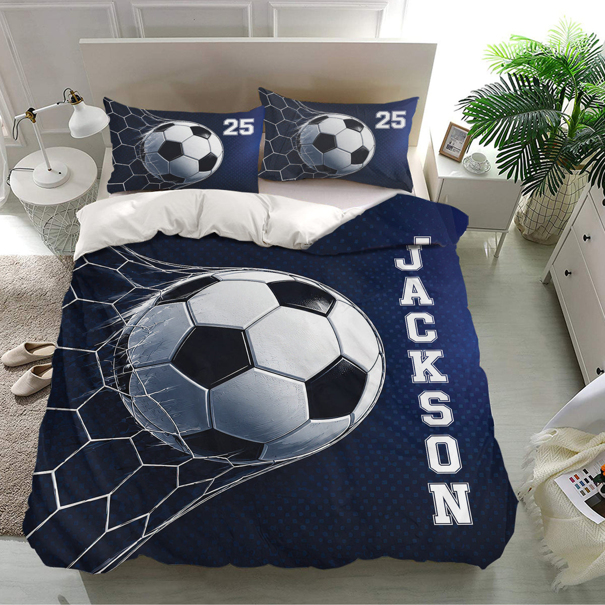 Navy soccer bedding set displayed in a bright bedroom with matching soccer ball pillow designs