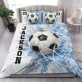 Soccer duvet cover set with oversized soccer balls, blue paint splashes, and bedroom styling