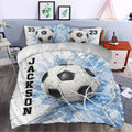 Soccer duvet cover set styled in a bedroom with large ball graphics and blue athletic artwork
