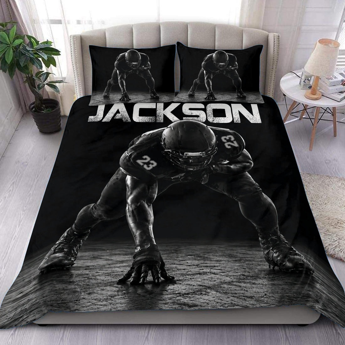 Black football duvet cover set displayed on a bed with matching player artwork on the pillowcases
