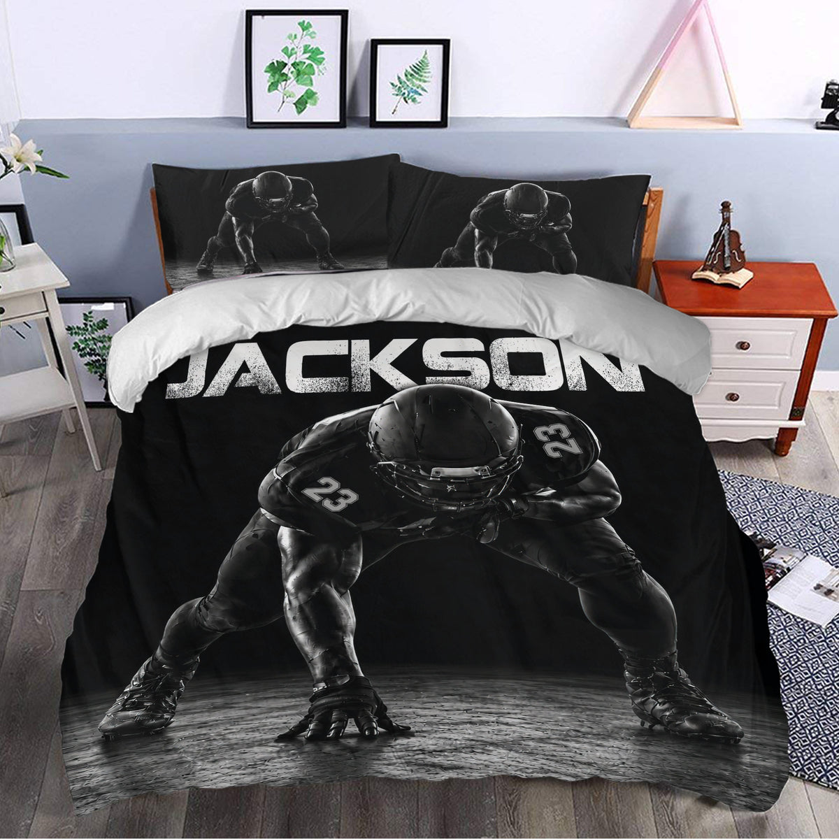 Black football bedding set styled in a bedroom with bold player artwork and custom lettering