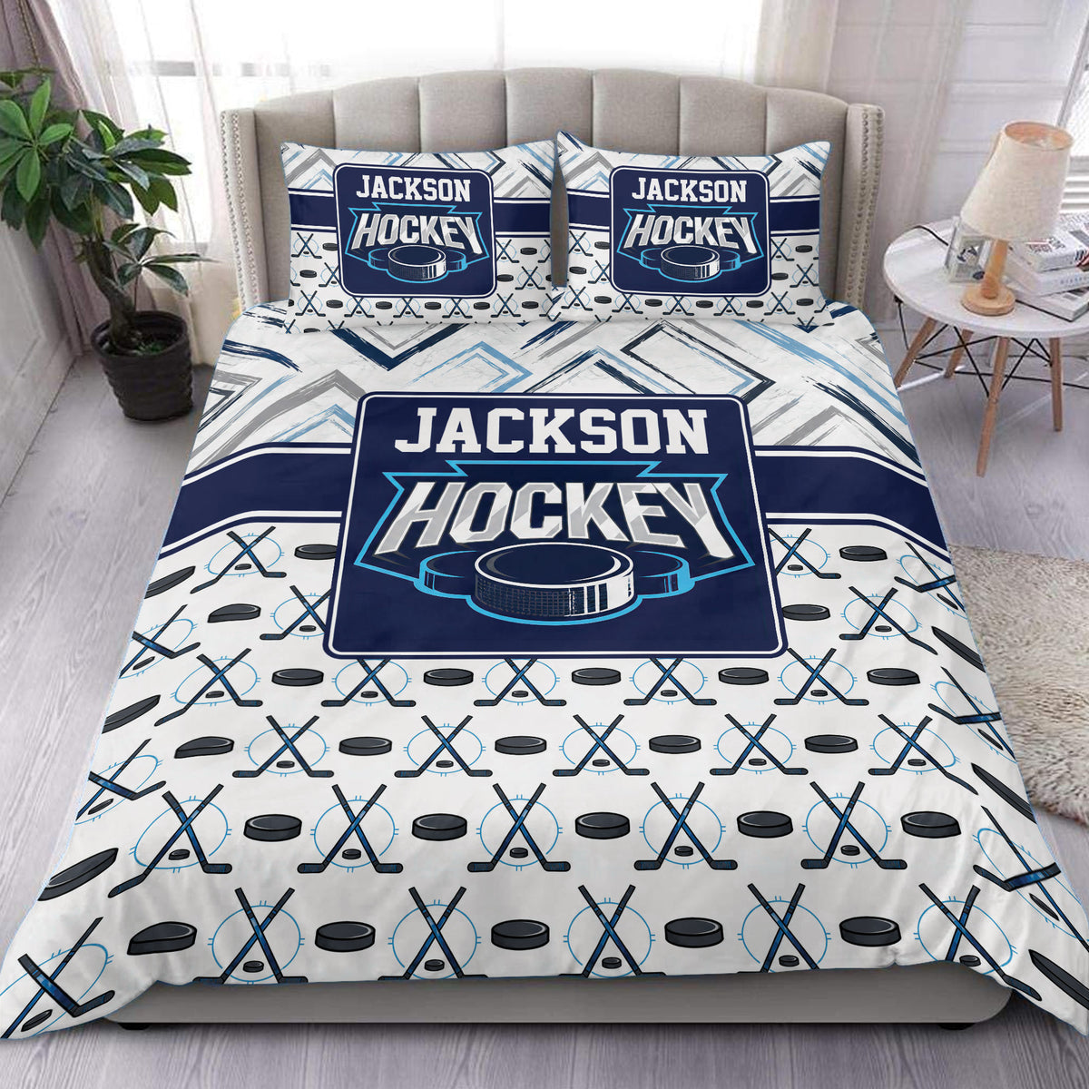 Hockey duvet cover set displayed on a bed with navy, white, gray, and cyan hockey artwork