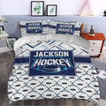 Hockey bedding set styled in a bedroom with crossed sticks, pucks, and bold navy graphics